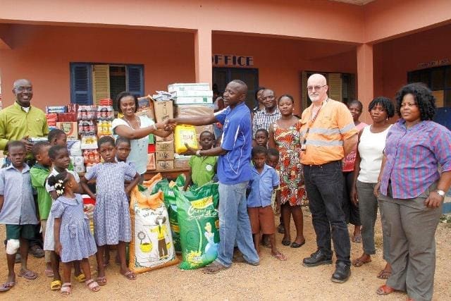 AGA's Delanyo Aheto-Tsegah presenting the items to Pastor James