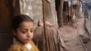 The file photo shows a girl in a refugee camp for Kashmiri villagers.