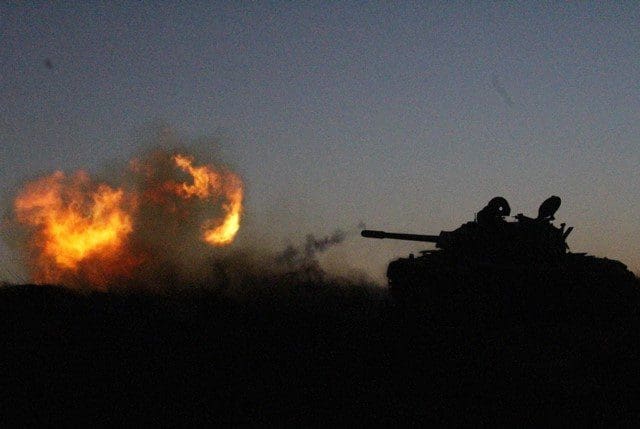 A Libya Dawn tank fires near Libya's capital city of Tripoli, on March 11, 2015. Clashes erupted on Wednesday between Libya Dawn militants and pro-government forces in the Ajaylat area some 80 kilometers west of Tripoli. (Xinhua/Hamza Turkia)