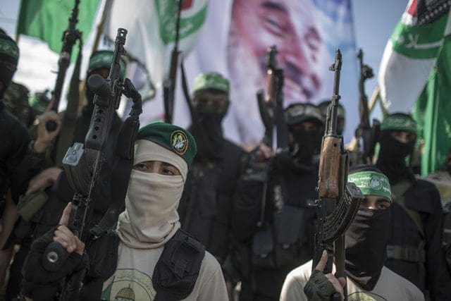 Palestinian Hamas militants take part in a parade to mark the 11th anniversary of the Israeli assassination of Hamas spiritual leader Sheikh Ahmed Yassin in Gaza city, on March 22, 2015. (Xinhua/Wissam Nassar)