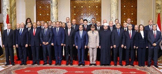 The handout photo from Egypt's state-run news agency MENA shows Egyptian President Abdel-Fattah al-Sisi (C, front) posing for a group photo with the new cabinet members in Cairo, Egypt, Sept. 19, 2015. Egyptian President Abdel-Fattah El-Sisi swore in on Saturday a new government, state media reported, just a week after the previous cabinet resigned following a corruption scandal. (Xinhua/MENA) The handout photo from Egypt's state-run news agency MENA shows Egyptian President Abdel-Fattah al-Sisi (C, front) posing for a group photo with the new cabinet members in Cairo, Egypt, Sept. 19, 2015. Egyptian President Abdel-Fattah El-Sisi swore in on Saturday a new government, state media reported, just a week after the previous cabinet resigned following a corruption scandal. (Xinhua/MENA)