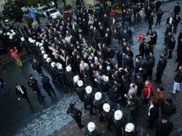 Supporters confront the police in front of the building of a media group in Istanbul, Turkey, on Oct. 28, 2015. Turkish police on Wednesday used tear gas and water cannon to storm the headquarters of the media group known for its opposition to the government. (Xinhua/Cihan)