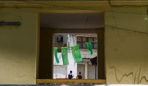 Two men walk under the flags of Tanzania's ruling party Chama Cha Mapinduzi in Stone Town of Zanzibar, Tanzania, on Oct. 28, 2015. Tanzania's semi-autonomous archipelago Zanzibar on Wednesday has cancelled results of its just-held general elections, according to Zanzibar Electoral Commission. (Xinhua/Zhai Jianlan) Two men walk under the flags of Tanzania's ruling party Chama Cha Mapinduzi in Stone Town of Zanzibar, Tanzania, on Oct. 28, 2015. Tanzania's semi-autonomous archipelago Zanzibar on Wednesday has cancelled results of its just-held general elections, according to Zanzibar Electoral Commission. (Xinhua/Zhai Jianlan)