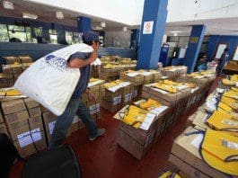 An employee of the Argentine Mail walks among ballot boxes that are ready to be delivered before the second round of the presidential elections, in Resistencia City, Chaco province, Argentina, on Nov. 21, 2015. A total of 32 million Argentinians are eligible to vote in the second round on next Sunday to elect the president that will succeed Cristina Fernandez in December. (Xinhua/German Pomar/TELAM) (da) (fnc)
