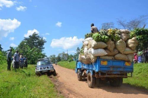 Photo taken on Nov. 26, 2015 shows a truck loaded with sacks of agricultural produce along the muddy Sironko-Mbale road at Bugusege trading centre, eastern Uganda. As a country where over 80% of the population relies on agriculture, the Uganda government is prioritizing growth of infrastructure to economically viable areas to ease access to the markets. (Xinhua/Daniel Edyegu) Photo taken on Nov. 26, 2015 shows a truck loaded with sacks of agricultural produce along the muddy Sironko-Mbale road at Bugusege trading centre, eastern Uganda. As a country where over 80% of the population relies on agriculture, the Uganda government is prioritizing growth of infrastructure to economically viable areas to ease access to the markets. (Xinhua/Daniel Edyegu)