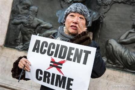 A woman in tears speaks to the press during a rally in support of New York City Police officer Peter Liang, at Brooklyn's Cadman Plaza Park, in New York, the United States, Feb. 20, 2016. Peter Liang, a New York City police officer of Chinese descent, was found guilty on Feb. 11 of manslaughter over the shooting of a black man, prompting concerns of discrimination. On Nov. 20, 2014, Liang, a 27-year-old with only a year and a half on the job, was patrolling with his partner in Brooklyn's East New York housing project when he was startled by a noise. In a stairway that prosecutors described as "pitch-dark," Liang drew his gun and fired. The bullet ricocheted off a wall and hit Akai Gurley on a lower level. (Xinhua/Li Muzi) A woman in tears speaks to the press during a rally in support of New York City Police officer Peter Liang, at Brooklyn's Cadman Plaza Park, in New York, the United States, Feb. 20, 2016. Peter Liang, a New York City police officer of Chinese descent, was found guilty on Feb. 11 of manslaughter over the shooting of a black man, prompting concerns of discrimination. On Nov. 20, 2014, Liang, a 27-year-old with only a year and a half on the job, was patrolling with his partner in Brooklyn's East New York housing project when he was startled by a noise. In a stairway that prosecutors described as "pitch-dark," Liang drew his gun and fired. The bullet ricocheted off a wall and hit Akai Gurley on a lower level. (Xinhua/Li Muzi)