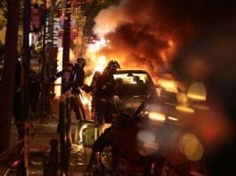 Cars were set alight and clashes erupted as at least 170,000 workers and students took to the streets across France (AFP Photo/Joel Saget)