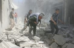 AFP/File / Ameer Alhalbi Syrians evacuate an injured man amid the rubble of destroyed buildings following a reported air strike on the rebel-held neighbourhood of Al-Qatarji, in Aleppo, on April 29, 2016