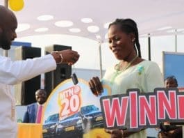 Eugenia Adama receiving her keys to the Range Rover Sports vehicle from Mr Noel Kojo Ganson