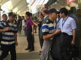 Chinese crew members (wearing caps) freed by Somali pirates arrive at the airport before heading home, in Nairobi, Kenya, Oct. 24, 2016. Nine out of the ten Chinese crew members freed by Somali pirates took a flight home on Monday from the Kenyan capital Nairobi, accompanied by officials sent from Beijing. (Xinhua/Sun Ruibo)
