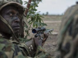 TOPSHOT - A member of the Nigerian Armed Forces Sniper Unit wearing a ghillie suit takes part in an exercise during the African Land Forces Summit (ALFS) military demonstration held at General Ao Azazi barracks in Gwagwalada on April 17, 2018. - The African Land Forces Summit (ALFS) is a weeklong seminar held in Nigeria, bringing together land forces from across Africa to discuss and develop cooperative solutions and improve transregional security and stability. (Photo by STEFAN HEUNIS / AFP) (Photo credit should read STEFAN HEUNIS/AFP/Getty Images)