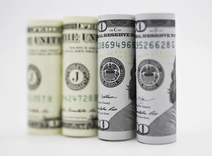 Photo taken on Sept. 18, 2019 shows U.S. dollar banknotes in Washington D.C., the United States. U.S. Federal Reserve on Wednesday lowered interest rates by 25 basis points amid growing risks and uncertainties stemming from trade tensions and a global economic slowdown, following a rate cut in July that was its first in more a decade. (Xinhua/Liu Jie)