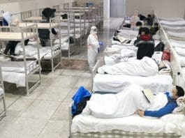 Patients infected with the novel coronavirus are seen at a makeshift hospital converted from an exhibition center in Wuhan, central China's Hubei Province, Feb. 5, 2020. The makeshift hospital converted from an exhibition center in China's epidemic-hit Wuhan city began accepting patients Wednesday. The hospital can provide about 1,600 beds to infected patients. (Xinhua/Xiong Qi)