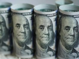 Photo taken on March 19, 2020 shows U.S. dollar banknotes in Washington D.C., the United States. The Trump administration's plan to send Americans relief money as part of a massive stimulus package in response to COVID-19 could be 1,000 U.S. dollars per person, and 500 dollars per child, Treasury Secretary Steven Mnuchin said Thursday. (Xinhua/Liu Jie)