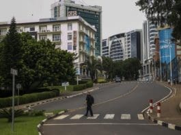 A pedestrian crosses a road in downtown Kigali, Rwanda, on March 22, 2020. On Saturday, Rwanda announced stricter measures to be implemented for the next two weeks in a bid to contain the spread of coronavirus, banning unnecessary movements of residents and ordering border closure. (Photo by Cyril Ndegeya/Xinhua)