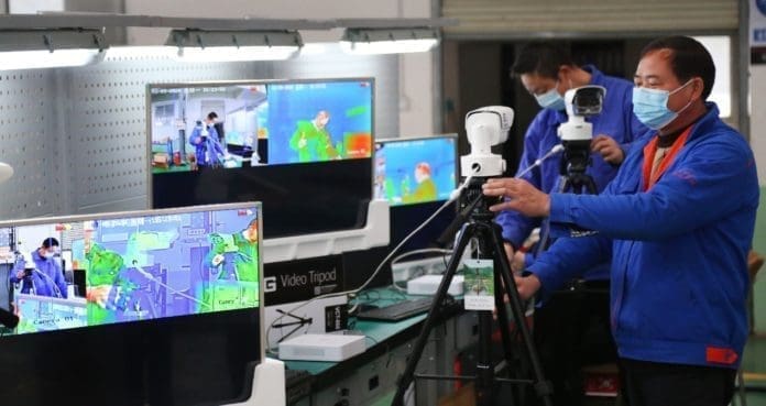 New type of thermo imaging system was tested in Xiangyang, Hubei Province. The system could check body temperature of 30-50 people simultaneously, which greatly improves the efficiency for fever screening in public places. Photo by Li Zhaoxu/People’s Daily