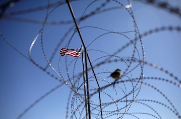 [Reuters]A U.S. flag fluters at the Paso del Norte International Border bridge, in Ciudad Juarez