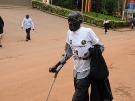 An elderly man participates in the anti-corruption walk in Kampala, capital of Uganda, Dec. 4, 2019. Ugandan President Yoweri Museveni on Wednesday led an anti-corruption walk in the capital city of the East African country. (Xinhua/Nicholas Kajoba)