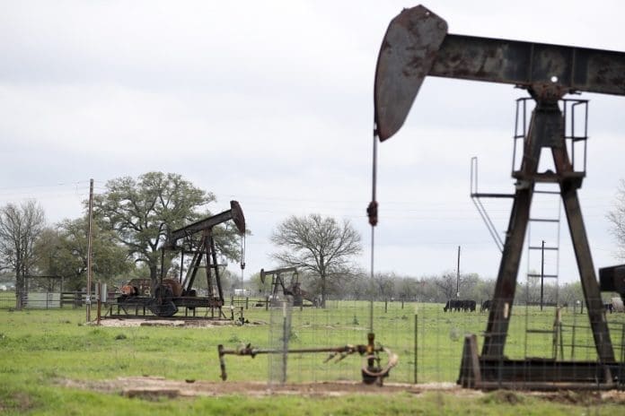 File photo taken on March 12, 2019 shows operating oil pumps in Luling of Texas, the United States. U.S. oil prices turned negative on April 20, 2020. West Texas Intermediate crude for May delivery shed more than 300 percent to settle at -37.63 U.S. dollars per barrel on the New York Mercantile Exchange. (Xinhua/Wang Ying)