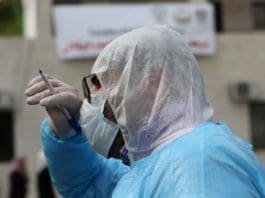 A member of Palestinian medical team is seen at an emergency center for monitoring, screening and preventive health care education about COVID-19, which was recently established by the Palestinian Ministry of Health, in the West Bank city of Nablus, March 9, 2020. Palestine on Monday reported six new cases of coronavirus, bringing the total number of the infected Palestinians to 25. (Photo by Ayman Nobani/Xinhua)
