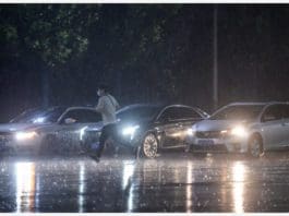 BEIJING, Aug. 12, 2020 (Xinhua) -- A man runs in rain in Daxing District, Beijing, capital of China, Aug. 12, 2020. Beijing meteorological authorities issued a yellow alert for rainstorms, forecasting that torrential rain would batter the Beijing-Tianjin-Hebei region between Wednesday and Thursday. (Xinhua/Peng Ziyang)