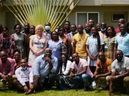 Participants in a group photograph section.