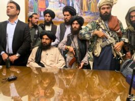 Taliban fighters take control of Afghan presidential palace after the Afghan President Ashraf Ghani fled the country, in Kabul, Afghanistan, Sunday, Aug. 15, 2021. (AP Photo/Zabi Karimi)