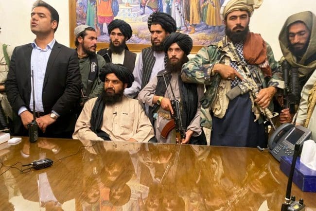 Taliban fighters take control of Afghan presidential palace after the Afghan President Ashraf Ghani fled the country, in Kabul, Afghanistan, Sunday, Aug. 15, 2021. (AP Photo/Zabi Karimi) Taliban fighters take control of Afghan presidential palace after the Afghan President Ashraf Ghani fled the country, in Kabul, Afghanistan, Sunday, Aug. 15, 2021. (AP Photo/Zabi Karimi)