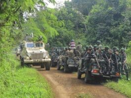 Congolese Defense Forces soldiers and United Nation forces patrol Beni, North Kivu, Democratic Republic of Congo on Friday, July 23, 2021. The government accuses Rwandan troop of incursions in the area. (AP Photo/Al-hadji Kudra Maliro)