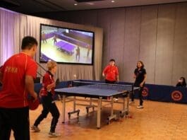 Chinese and U.S. ping-pong players play an exhibition match during a commemorative activity marking the 50th anniversary of the Ping Pong Diplomacy held in Houston, the U.S., on Nov. 23, 2021. (Photo by Zhang Mengxu/People’s Daily Online)