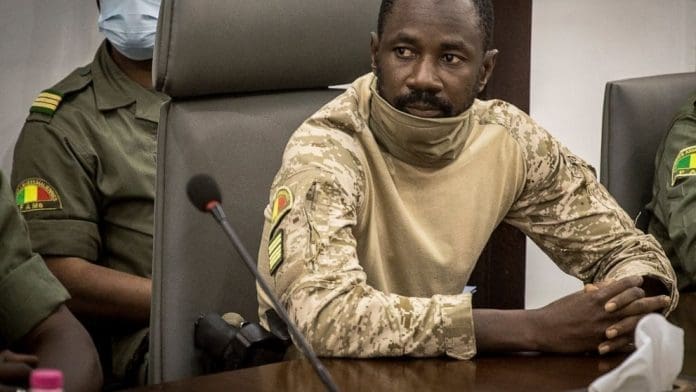 FILE - Col. Assimi Goita meets with a high-level delegation from the West African regional bloc known as ECOWAS, at the Ministry of Defense in Bamako, Mali on Aug. 22, 2020. Explosions and gunfire were heard Friday July 22, 2022 in the area of the Kati military base on the outskirts of Bamako, according to local residents, in a suspected attack by Islamic extremists. Goita frequently stays at the Kati camp, where he launched the 2020 coup that brought him to power. (AP Photo, File) The Associated Press