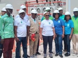 UNDP Resident Rep. Dr. Lusigi (middle in white) poses with staff of the BPA