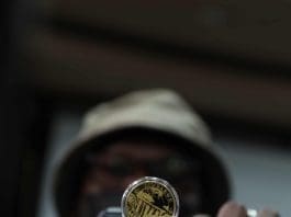 Zimbabwe's newly introduced gold coin is pictured in Harare, Zimbabwe, July 25, 2022. The Reserve Bank of Zimbabwe Governor John Mangudya on Monday unveiled gold coins that are expected to act as a store of value and reduce the demand for U.S. dollars as the country battles to control soaring inflation. (Photo by Shaun Jusa/Xinhua)