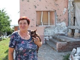 With IOM’s assistance, Nina’s family was able to repair the roof of her house that was damaged by shelling. Photo: IOM/Anastasiia Rudnieva