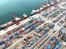 Containers are being handled at a terminal of the Lianyungang port, east China's Jiangsu province, Aug. 8, 2022. Since this year, the Lianyungang port has fully leveraged its advantages in integrated transport development and rail-ocean intermodal transport, to promote high-quality development China-Europe freight trains. (Photo by Wang Chun/People's Daily Online)