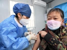 A medical worker injects the COVID-19 vaccine for a resident in Guiyang, southwest China's Guizhou province, Dec. 9, 2022. (Photo by Zhao Song/People's Daily Online)