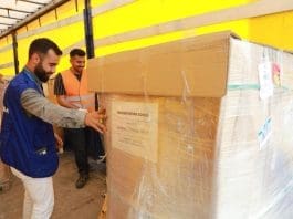 IOM team in Hatay unloads clothes to hand over to national partners for further distribution. Photo: IOM 2023/Begum Basaran Women choose clothes in a social market temporarily organized in a camp in Northwest Syria. Photo: IOM 2023 IOM team in Hatay unloads clothes to hand over to national partners for further distribution. Photo: IOM 2023/Begum Basaran Women choose clothes in a social market temporarily organized in a camp in Northwest Syria. Photo: IOM 2023
