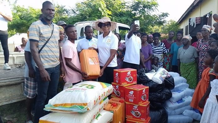 Miss Millie Kumasenu Left Presenting The Items To The Assembly Member Derrick Kugah