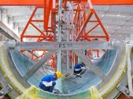 Wind turbine blades are manufactured in a workshop of a new material company in Changji Hui autonomous prefecture, northwest China's Xinjiang Uygur autonomous region. (Photo by He Long/People's Daily Online)