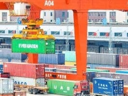 Containers are hoisted by cranes at an international land port in Ganzhou, east China's Jiangxi province. (Photo by Hu Jiangtao/People's Daily Online)