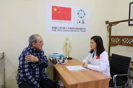 A local resident seeks acupuncture treatment from a Chinese doctor at the Mediterranean Regional Center for Traditional Chinese Medicine (MRCTCM) in Malta. (Photo by Xie Yahong/People's Daily) A Local Resident Seeks Acupuncture Treatment From A Chinese Doctor