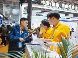 Staff Members Of An Exhibitor At The Th China Cross Border E Commerce Trade