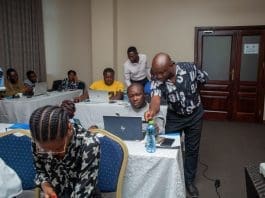 Facilitators Actively Engaging Participants In Practical Hands On Session During The Worshop