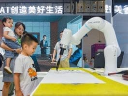 An artificial intelligence-enabled robotic arm writes Chinese calligraphy at the fourth China International Consumer Products Expo (CICPE) held in Haikou, south China's Hainan province, April 2024. (Photo by Yang He/People's Daily Online)