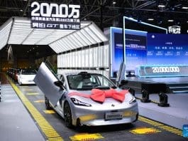 This photo taken on July 3, 2023 shows China's 20 millionth new energy vehicle (NEV) produced by GAC Aion New Energy Automobile Co., Ltd. in Guangzhou, south China's Guangdong Province. China's 20 millionth NEV rolled off the production line on Monday in Guangzhou, creating a remarkable milestone for the country's NEV sector. (Xinhua/Deng Hua)