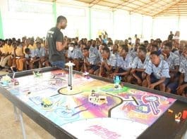 One Of The Partners Taking Students Through Robotics