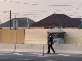 This screenshot captured from a video released on June 23, 2024 shows police patrolling in the street of Russia's Republic of Dagestan.