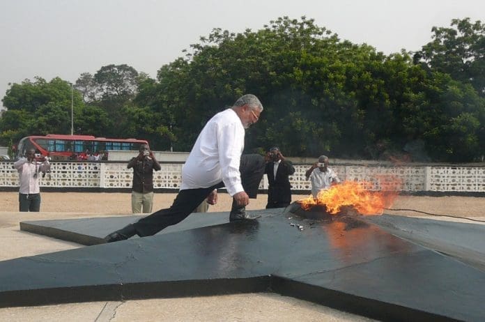 President About To Touch The Perpetual Flame Lit In Honour Of The Fallen Heroes Of The Revolution