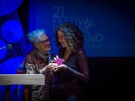Director Farida Benlyazid presents the Best Feature Film Award to Lina Soualem