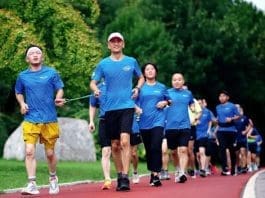 Individuals With Visual Impairment Run At The Beijing Olympic Forest Park